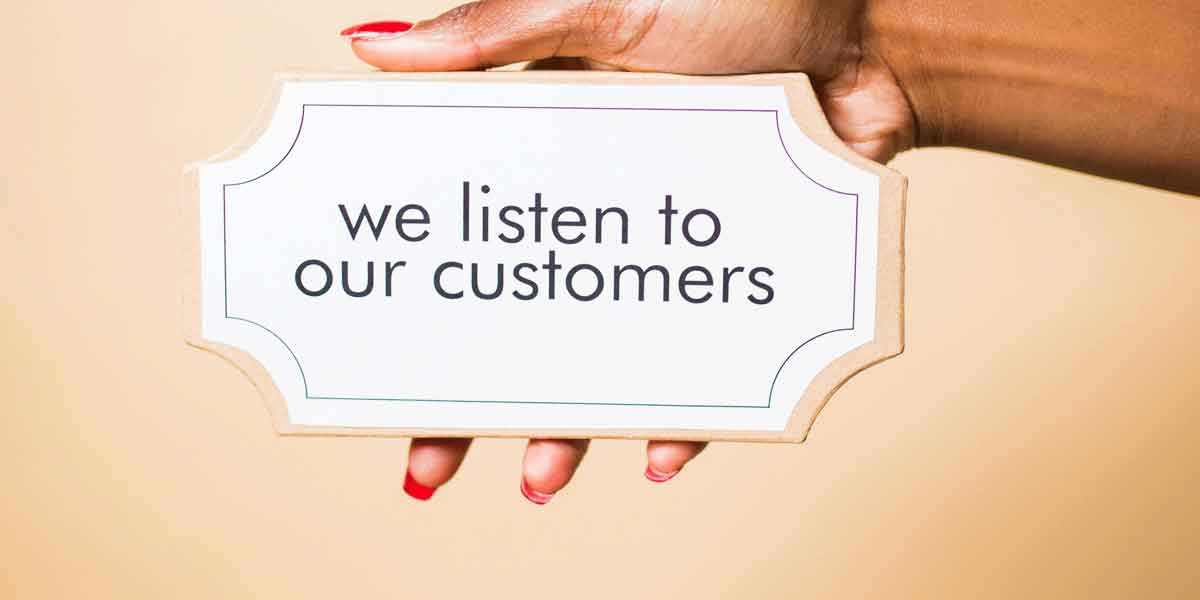 sign says we listen to our customers